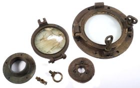 A collection of salvaged fixtures and fittings:, comprising a small bronze porthole,