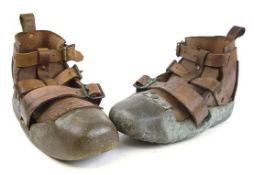 A matched pair of brass sand shoes, one by C E Heinke & Co Ltd, London,