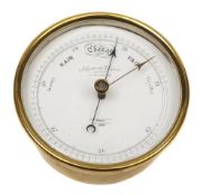 A circular brass cased barometer by Negretti & Zambra, London:,