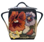 A Moorcroft pottery two handled box and cover: of square form tubelined in the Clementine Pansy
