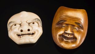 A Japanese carved ivory okimino Noh mask of a smiling man: having a furrowed brow and broad smile,