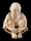 A Japanese carved ivory netsuke,