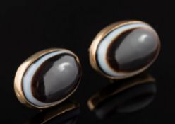 A pair of 9ct gold and oval banded agate single stone ear studs: each agate approximately 15mm long