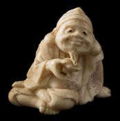 A Japanese carved ivory okimono,