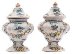 A pair of Italian maiolica vases and covers: probably Pesaro, of fluted ogee form,