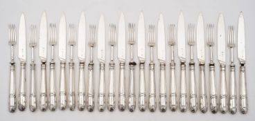 A set of twelve George III silver fruit knives and twelve matching forks, maker I.