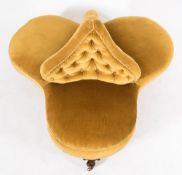 A Victorian carved walnut conversation seat:, of trefoil outline,