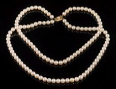 A graduated cultured pearl two-string necklace: with cultured pearls graduated from 7mm to 7.