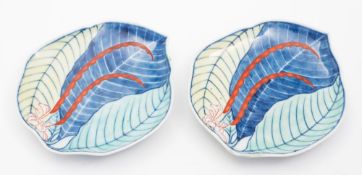 A pair of Japanese Nabeshima style porcelain dishes: of leaf shaped form decorated in underglaze