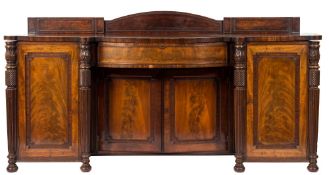 A Regency mahogany sideboard:, of bowed and breakfront outline,