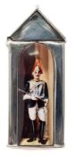A sterling silver and enamel novelty vesta case: in the form of a sentry box with dismounted