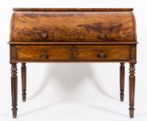 An early 19th Century mahogany cylinder fronted bureau:,