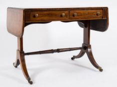 A Regency rosewood and inlaid sofa table:, bordered with boxwood and ebony lines,