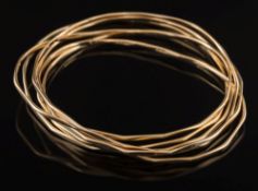 Six 9ct gold wire bangles:, 23gms gross weight.