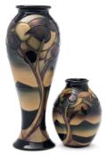 Two Moorcroft pottery vases: one of slender baluster form, the other of oviform,