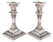 A pair of late Victorian silver candlesticks, maker John & William F Deakin, Sheffield,