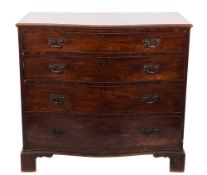 A George III mahogany serpentine fronted chest:, the top with a moulded edge,