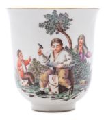 A Continental porcelain chocolate cup: with flared rim and scroll handle,