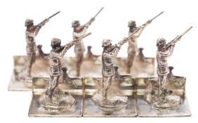 A set of six Elizabeth II silver novelty menu stands, maker A J Poole, Birmingham,