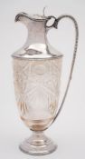 An Edward VII silver mounted and clear glass claret jug, maker Goldsmiths & Silversmiths Co Ltd,