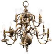 A Dutch-style twelve-light brass chandelier: the two-tiers of scrolling branches hung from a