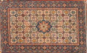 Two similar Erivan rugs:, the beige lattice fields with geometric foliate and palmette designs,