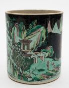 A Chinese famille noire porcelain brush pot, Bitong: painted in green,