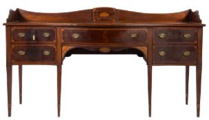An early 19th Century mahogany crossbanded and inlaid serpentine fronted sideboard:,