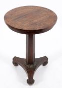 A late Regency rosewood and inlaid circular occasional table:,