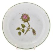 A Chinese saucer: painted in green and pink with a single peony branch with two buds, Qianlong, 13.