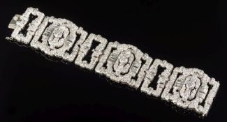 A 1930s diamond mounted bracelet: with three large rectangular openwork links and three smaller