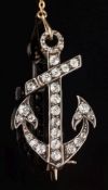 A graduated diamond 'anchor' brooch: set with round old brilliant-cut diamonds, with safety chain,