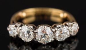 A graduated diamond five-stone ring: with circular old-cut diamonds estimated to weigh a total of 1.
