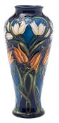A Moorcroft pottery vase: of slender baluster form tubelined in the Loch Hope pattern after the