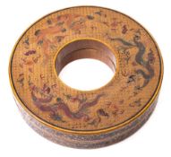 A Chinese tianqi lacquered 'dragon' box and cover: of pierced circular or ring-shaped form,