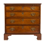 A George III mahogany chest: the top with a moulded edge fitted with a brushing slide and