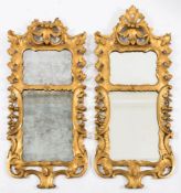 A matched pair of carved giltwood wall mirrors:,