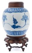 A Chinese blue and white ginger jar: painted with a continuous flowering lotus stem between foliate