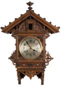 A carved oak cuckoo clock: the eight-day duration,