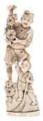 A Japanese carved ivory okimono of a farmer and son: he holding aloft a string of gourds,