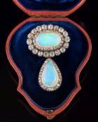 A mid 19th century opal and diamond cluster brooch: the oval opal approximately 19.3mm x 11.