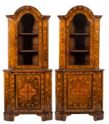 A pair of early 19th Century Dutch walnut and floral marquetry standing corner display cabinets:,