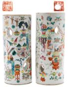 A matched pair of Chinese famille rose hat stands: of pierced cylindrical form and painted overall