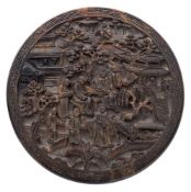 A 19th century Chinese carved tortoiseshell circular box and cover: the lift-off lid decorated with