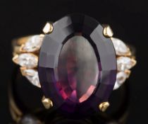 An amethyst and diamond oval cluster ring: the oval amethyst 17.8mm long x 13.2mm wide x 8.