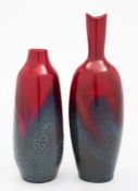 Two Royal Doulton flambe bottle vases: each of slender form,