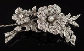 A white metal and diamond tremblant floral spray brooch: with graduated old-cut diamonds,