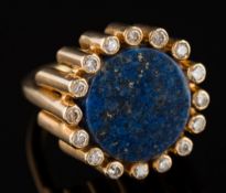A lapis lazuli and diamond circular cluster ring: the circular lapis lazuli approximately 14mm