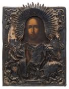 A mid 19th century Russian icon, Christ Pantocrator: oil on board encased in a silver oklad,
