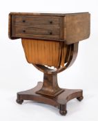 An early Victorian rosewood drop flap work table:, the hinged top with rounded corners,